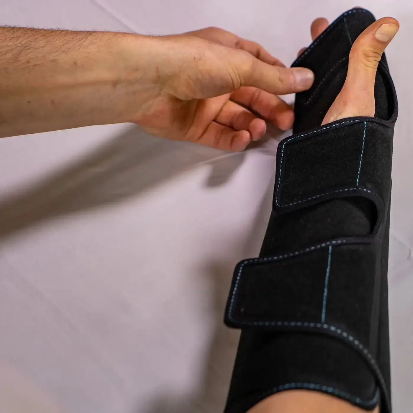 The NICE hand and wrist wrap secured on a forearm