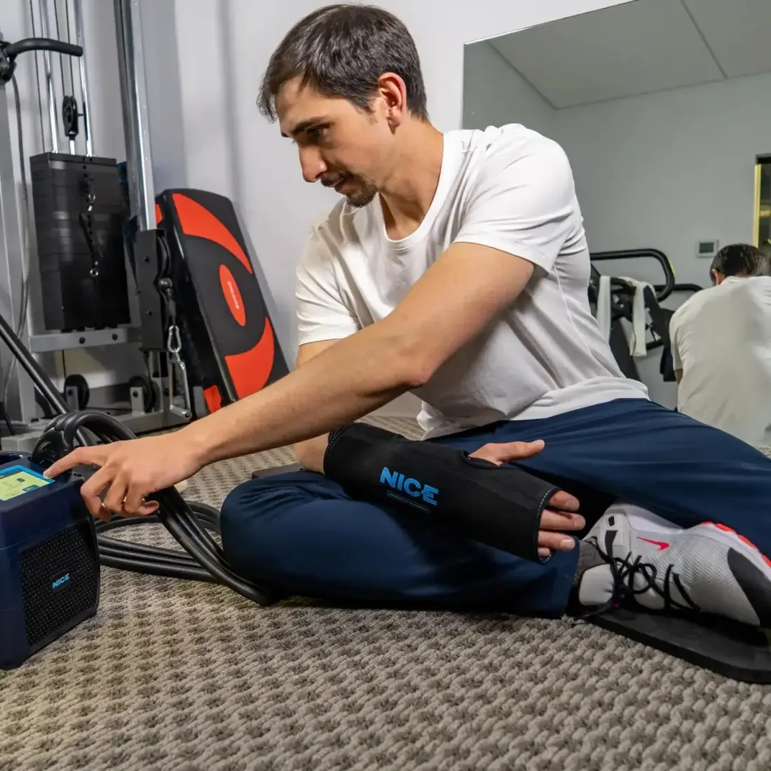 An athlete wearing the NICE hand and wrist wrap connected to the NICE1